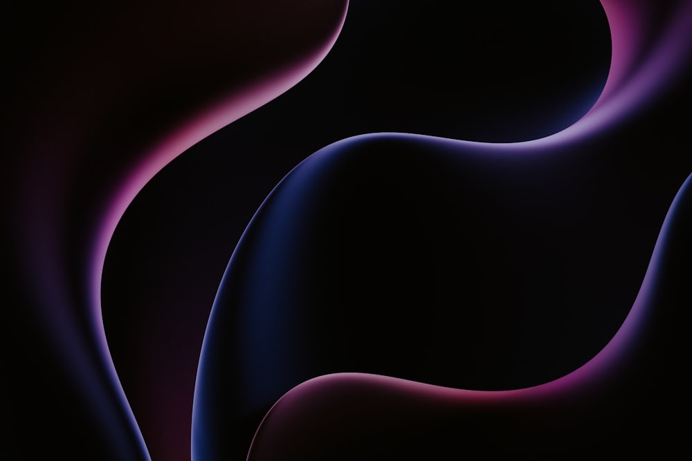 a black background with a pink and blue swirl