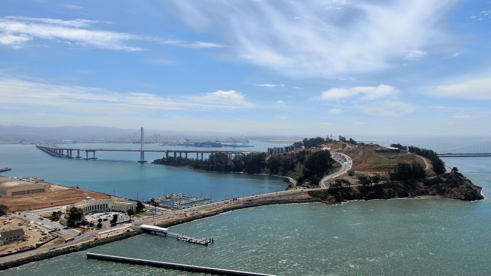 an aerial view of a bridge over a body of water