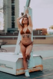 a woman in a bikini standing on a lift