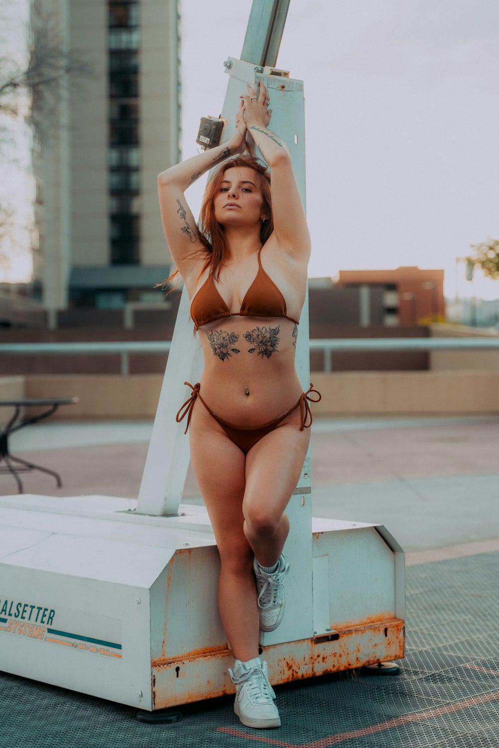 a woman in a bikini standing on a lift