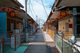 a narrow street lined with lots of buildings