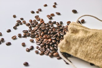 a bag of coffee beans spilling out of it