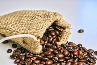 a bag of coffee beans spilling out of it