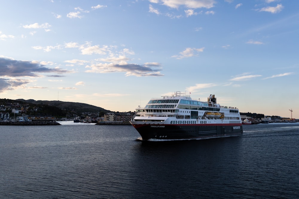 a large cruise ship in the middle of a body of water