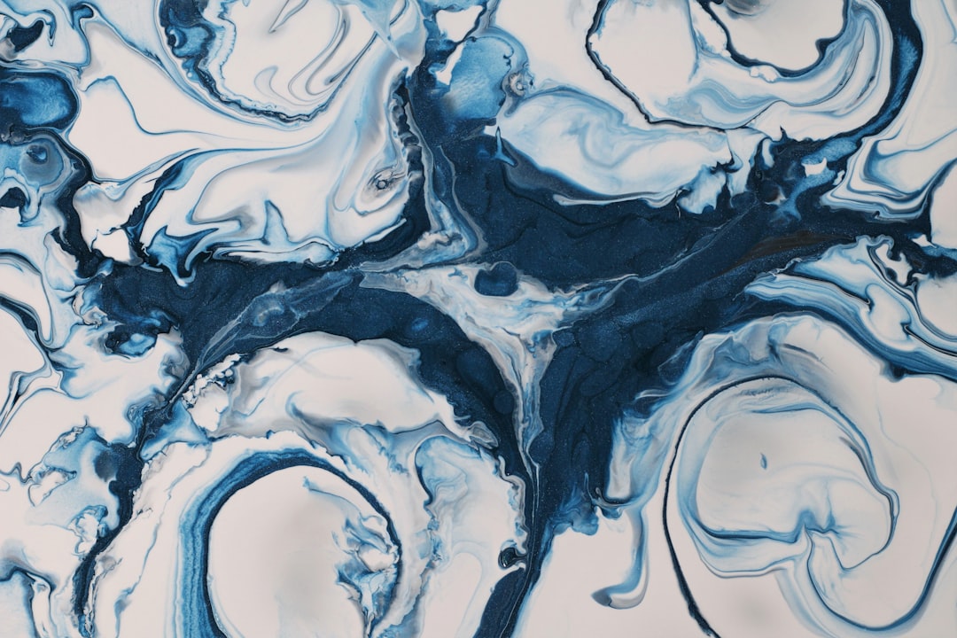 a blue and white abstract painting on a white background,