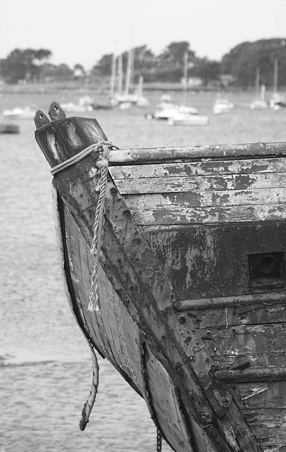 a black and white photo of a boat in the water