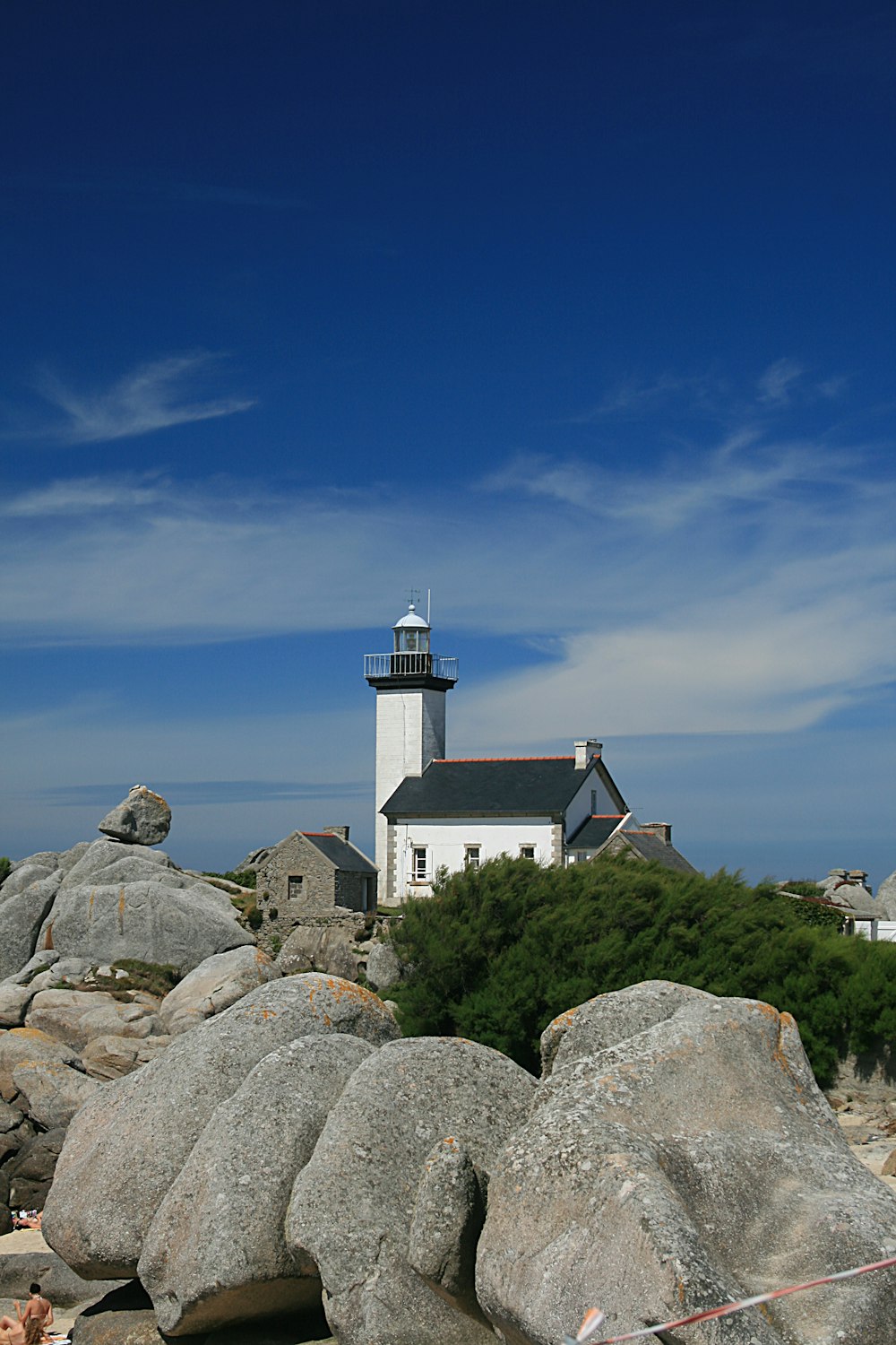 a lighthouse on top of a rocky cliff