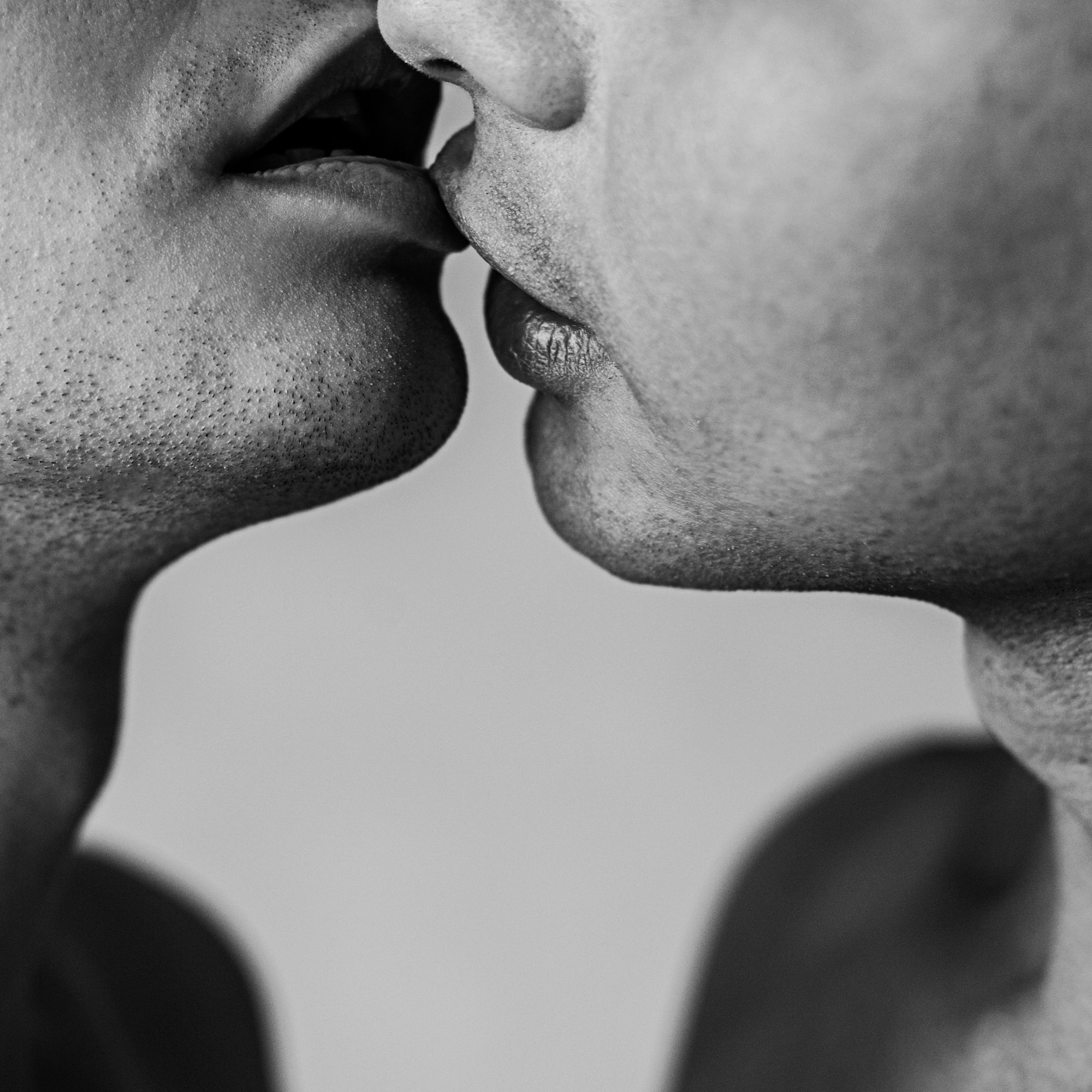 two men kissing 
