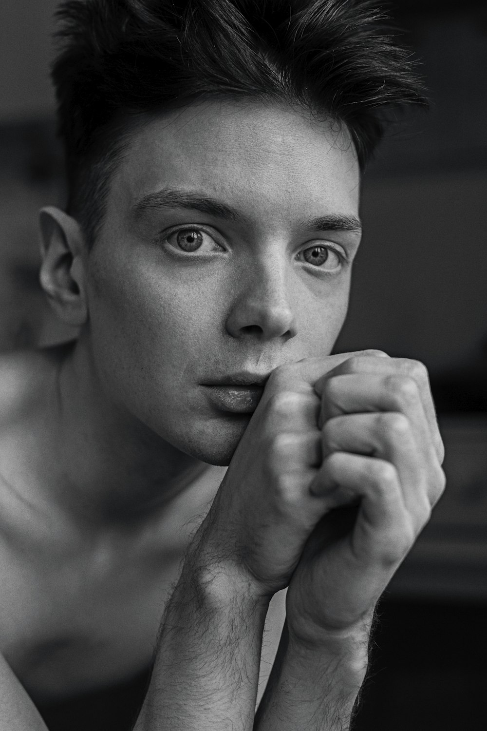 a black and white photo of a shirtless man