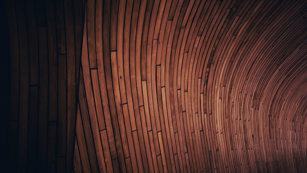 a close up of a wooden structure with a light at the end