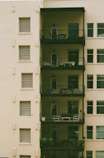 an apartment building with balconies and balconies on the balconies