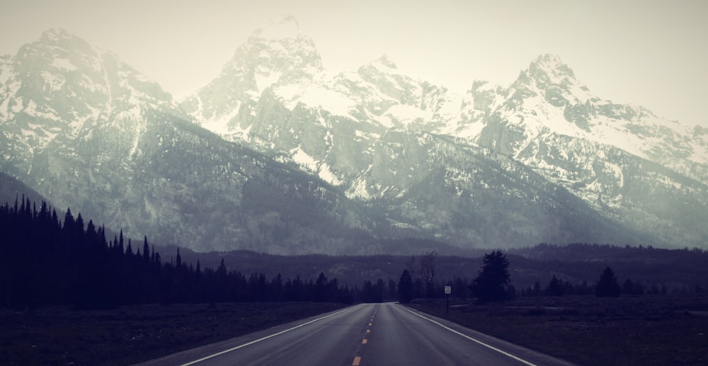 a road with a mountain in the background