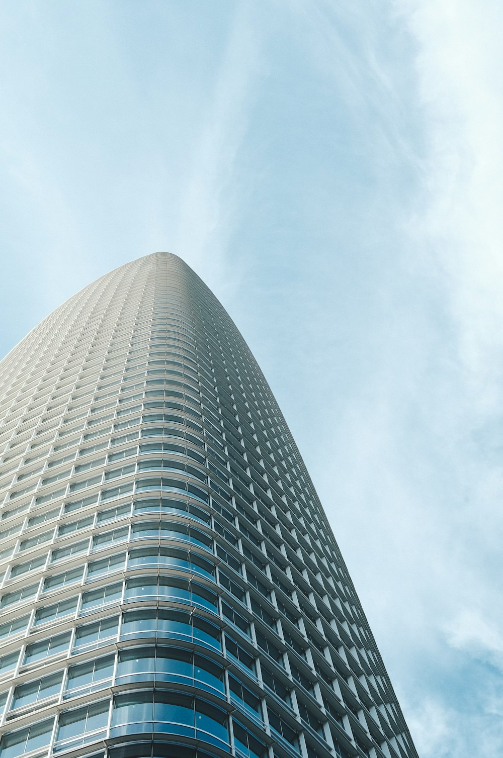 a very tall building with a sky background