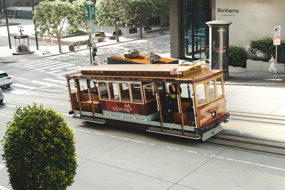a trolley car traveling down a city street