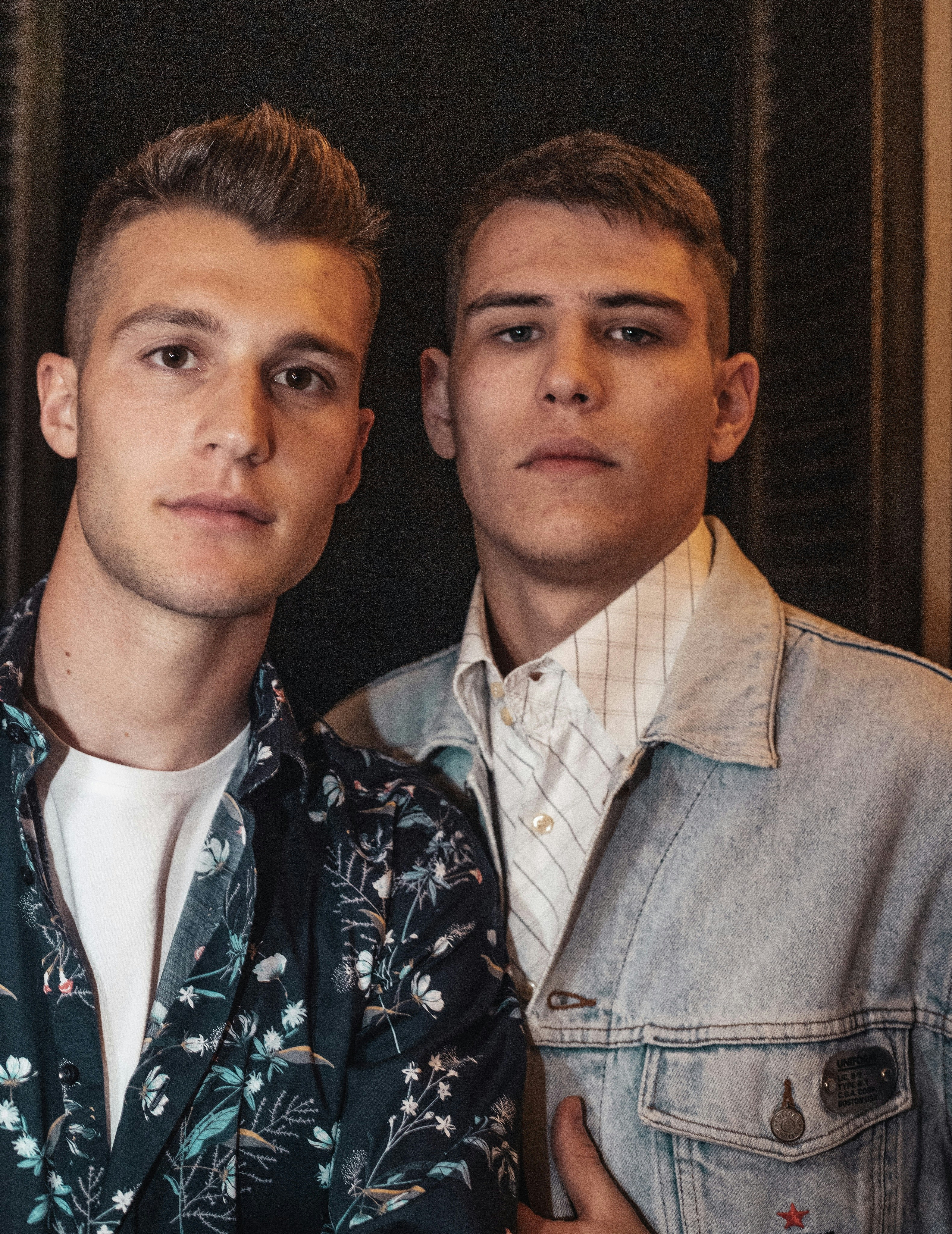 two young men standing next to each other