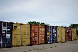 a row of colorful shipping containers sitting next to each other
