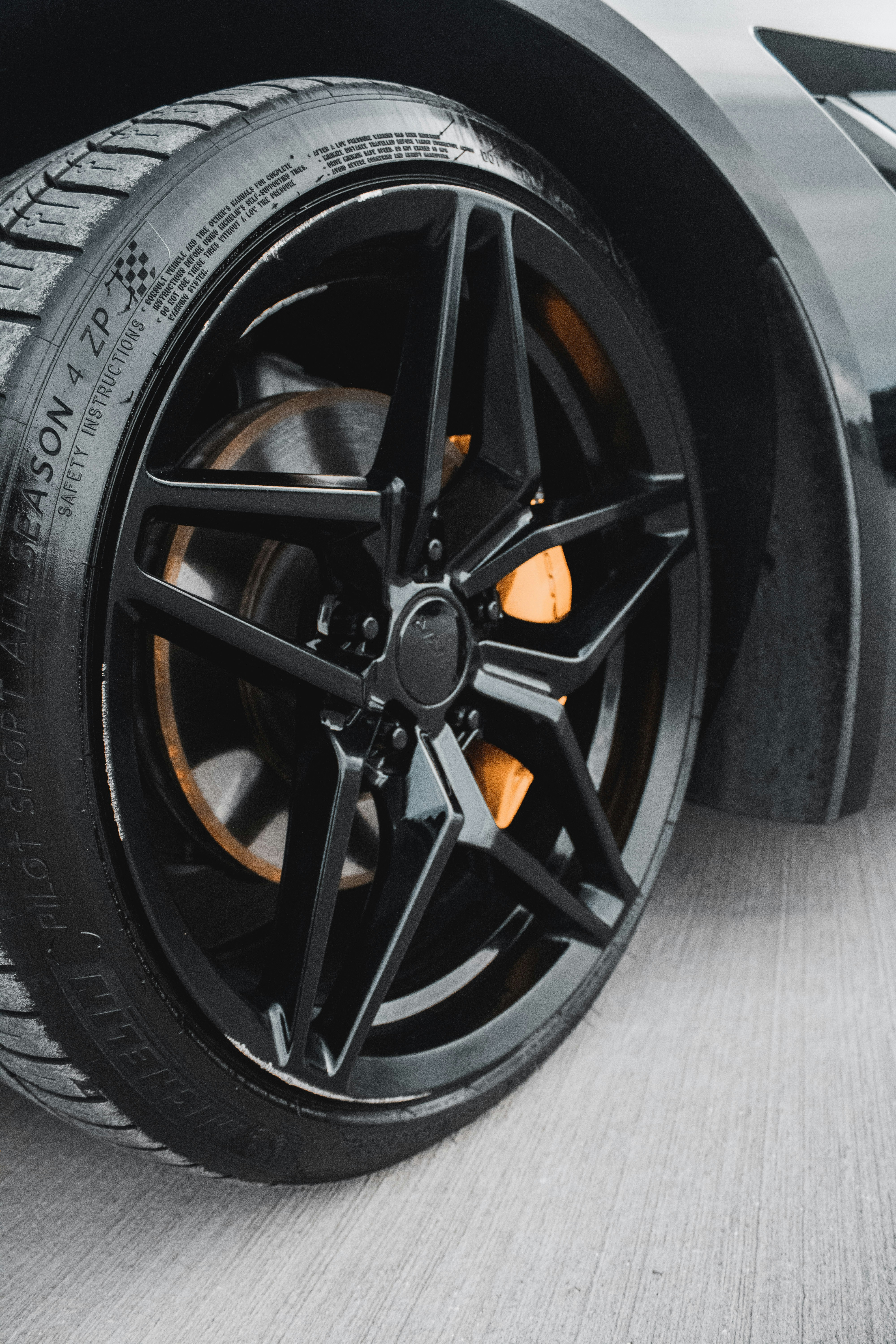 a close up of a tire on a sports car