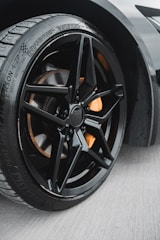 a close up of a tire on a sports car