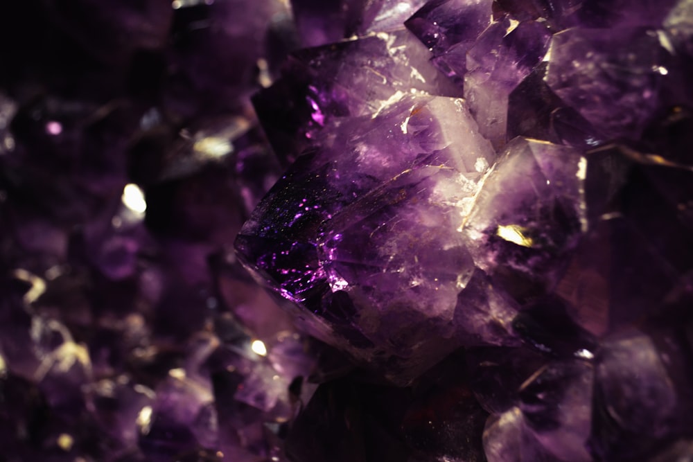 a close up of a bunch of purple crystals