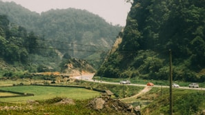 A scenic landscape featuring electric vehicles on a road trip.