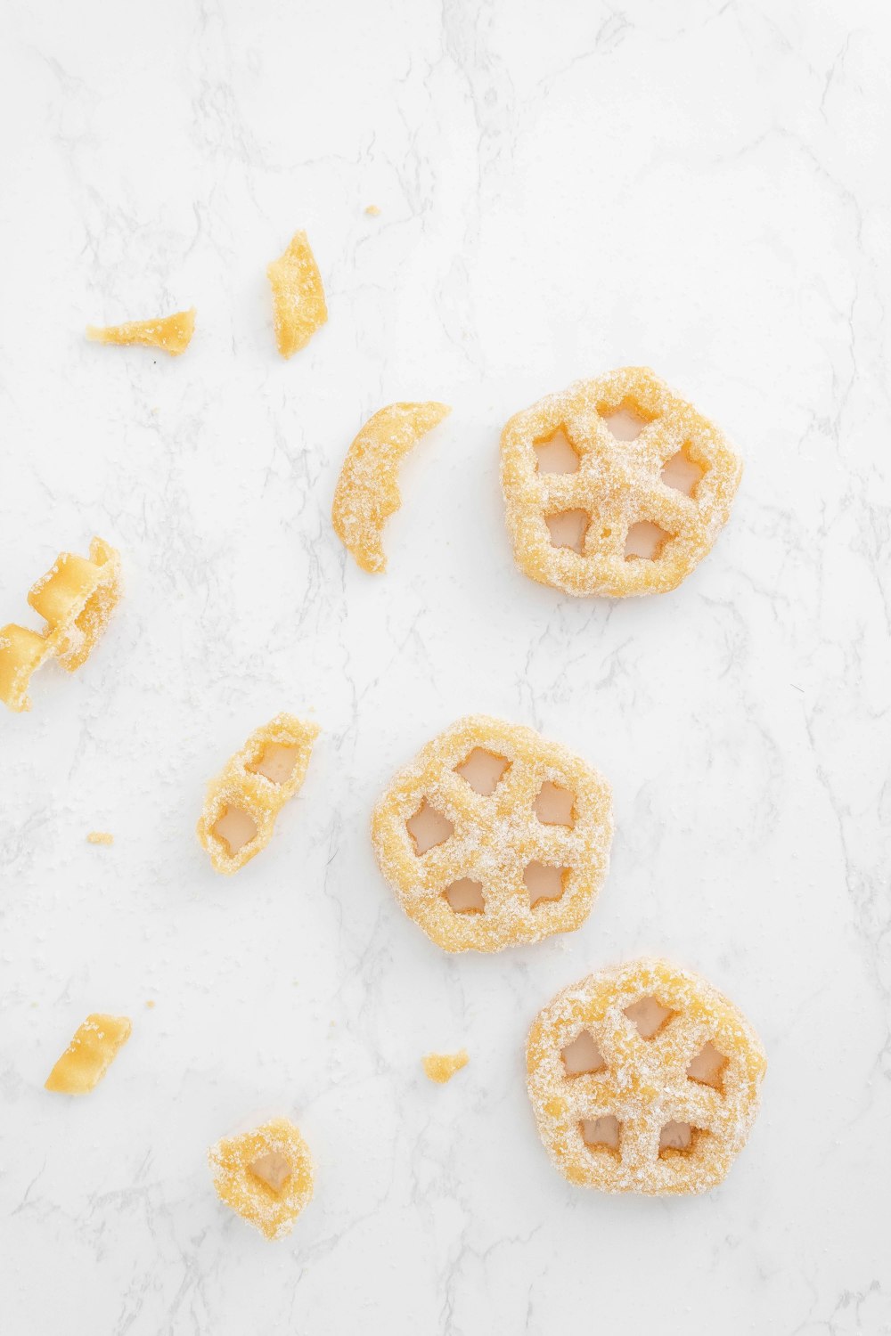 a marble counter top with three small pastries on top of it