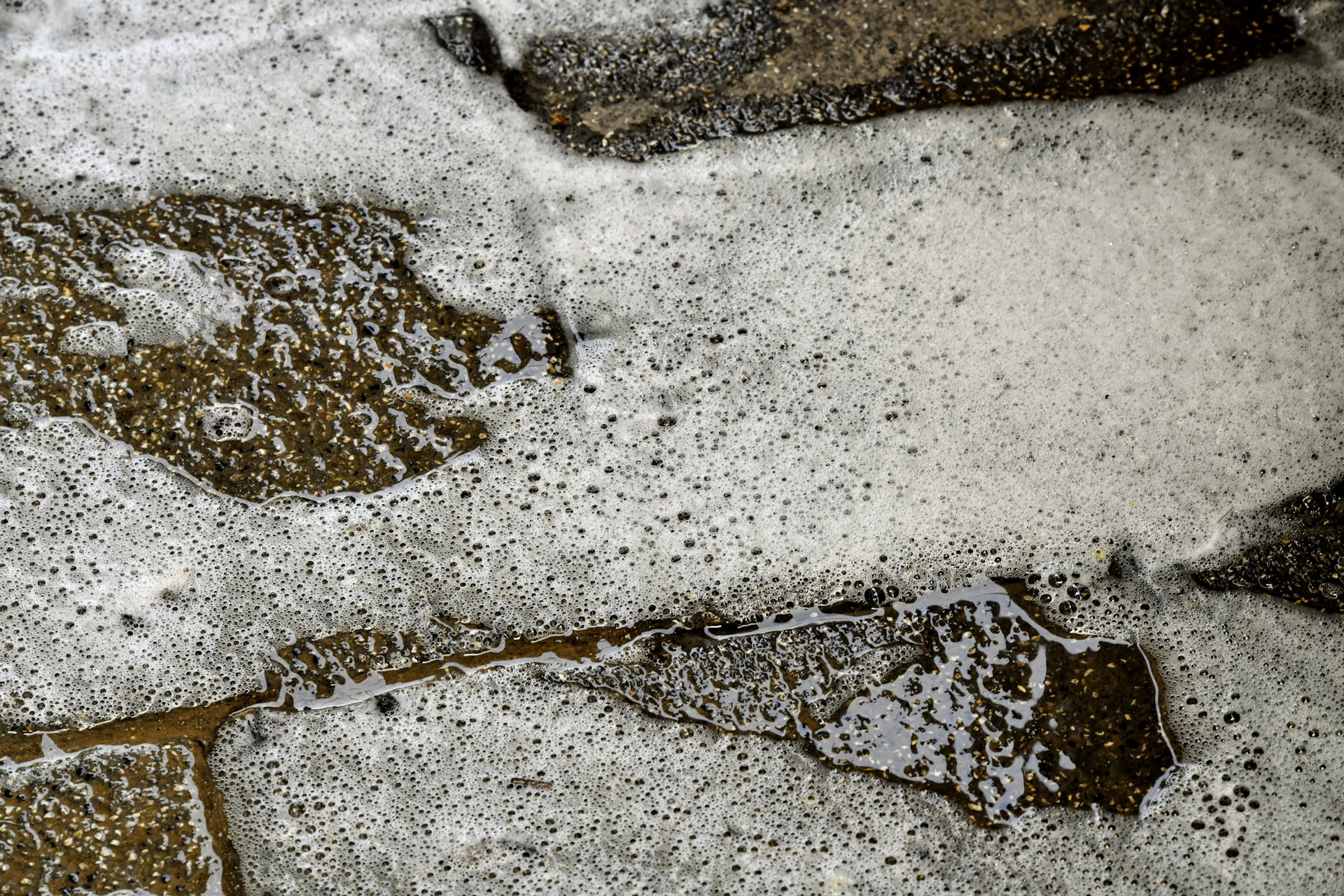 a close up of a street with snow on it