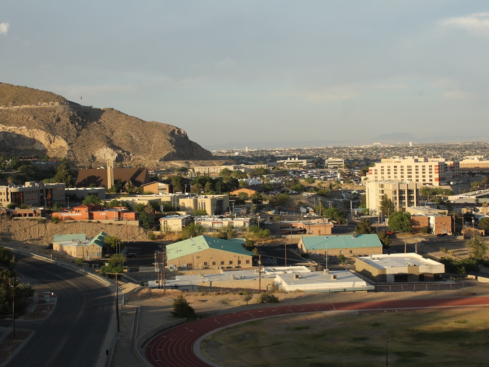 a view of a city with mountains in the background