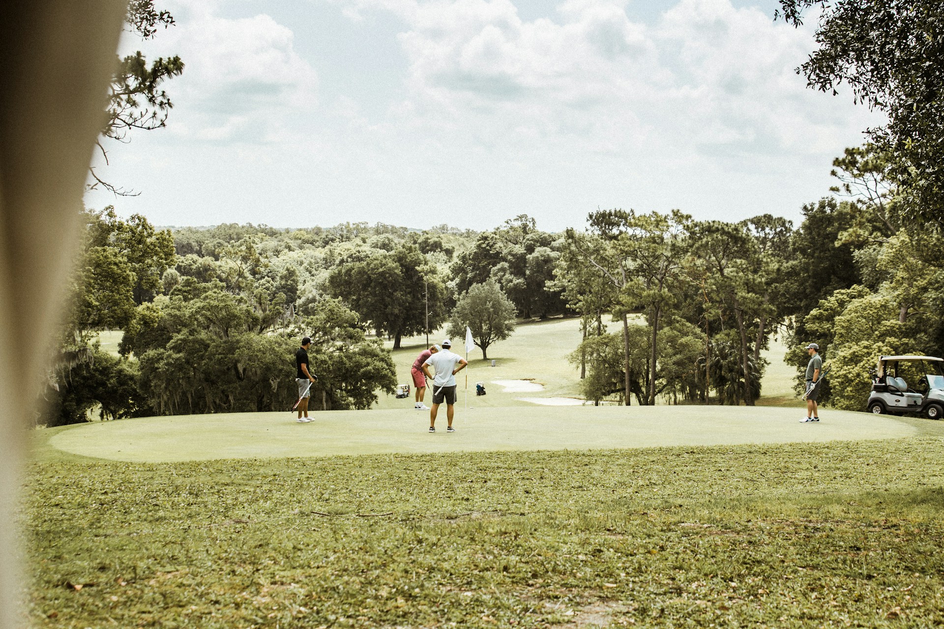 woman wearing yellow long-sleeved dress under white clouds and blue sky during daytime