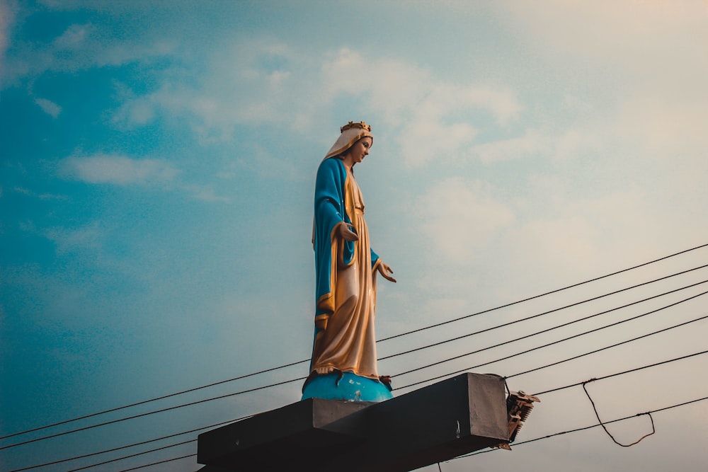 a statue of jesus on top of a building