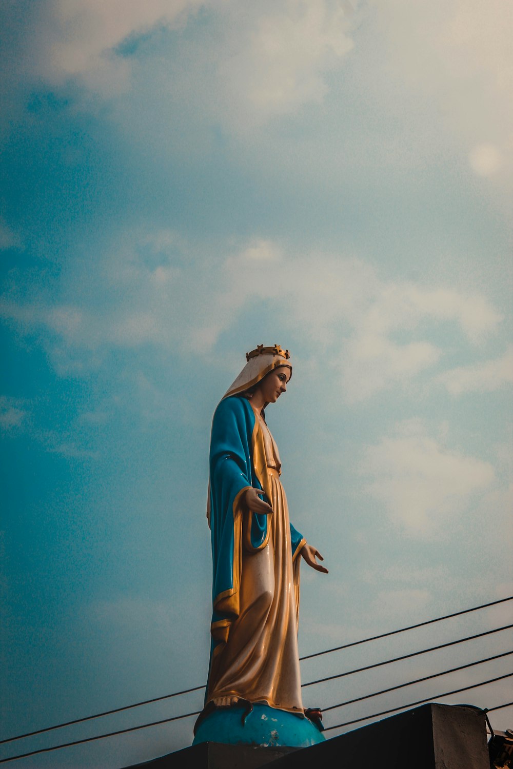 a statue of jesus on top of a building