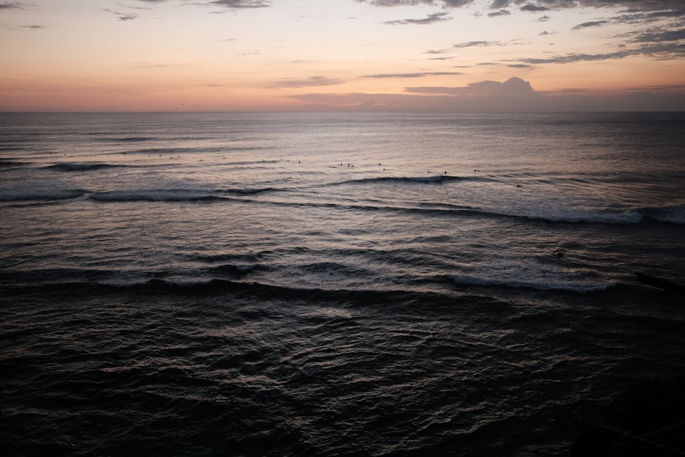 a body of water with waves coming in to shore