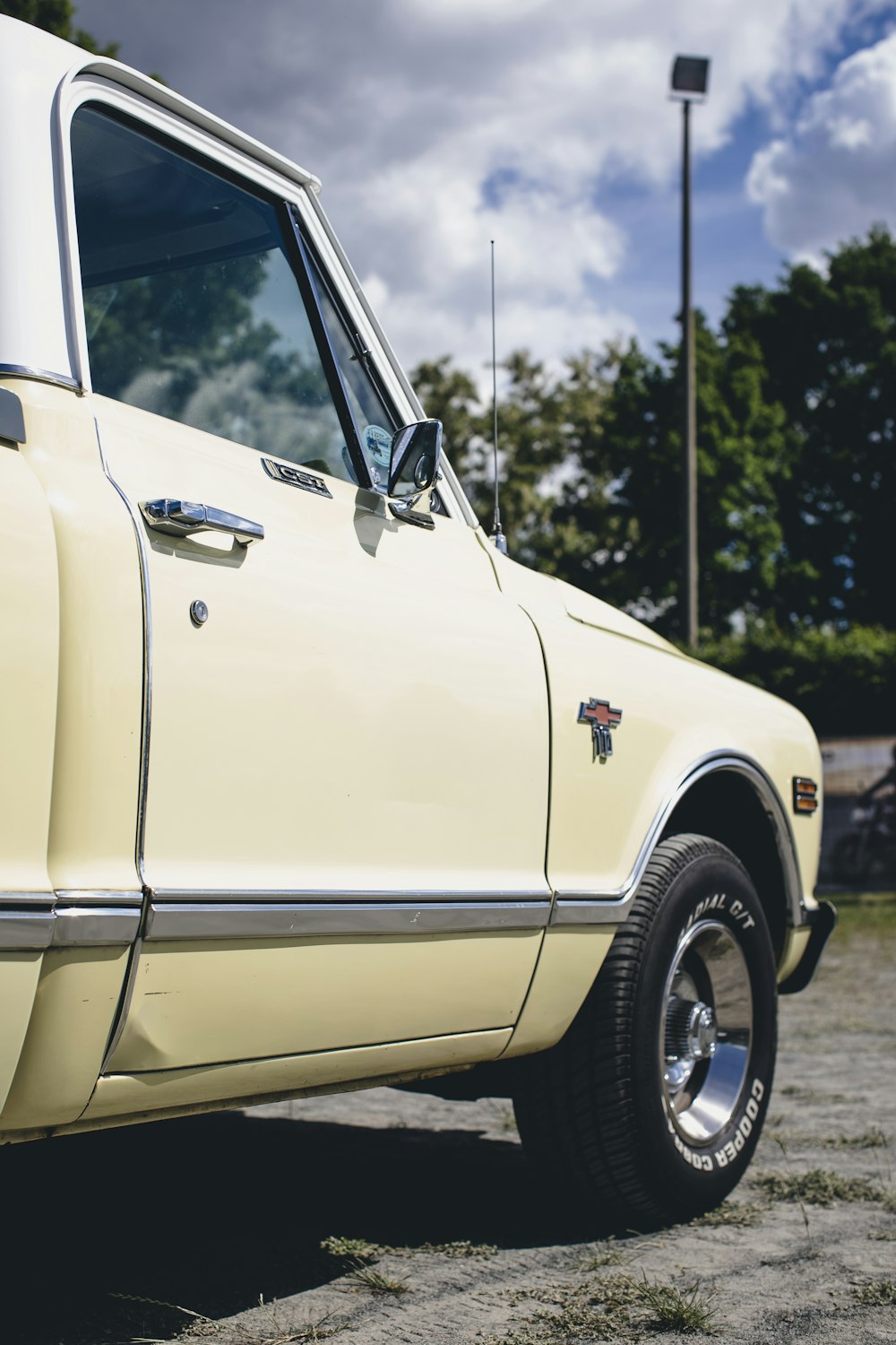 a yellow truck parked in a parking lot