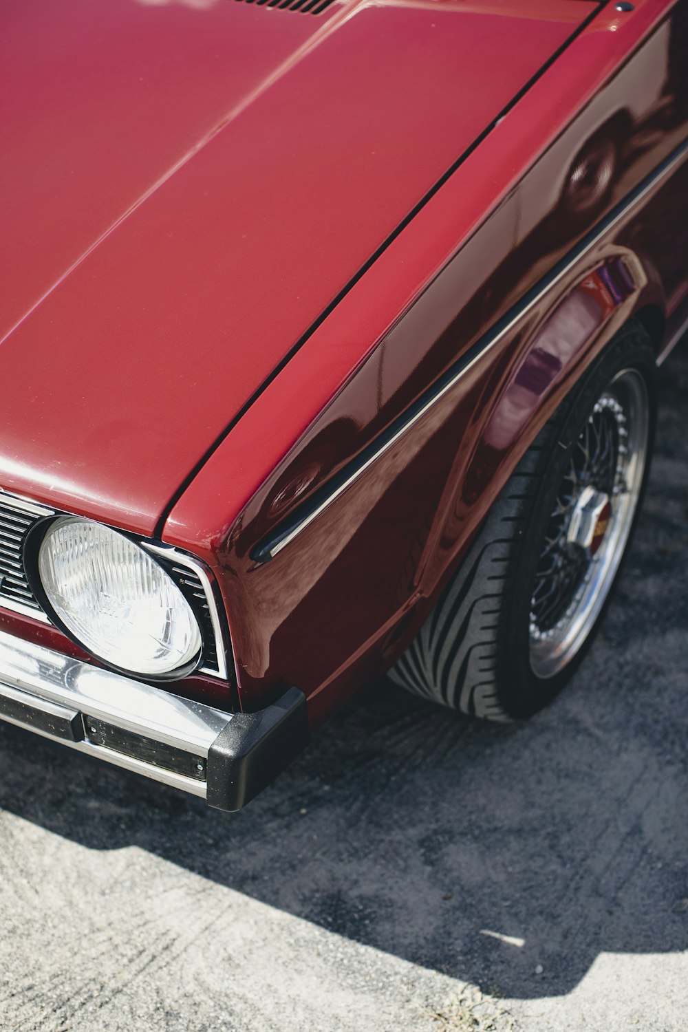 a red car parked in a parking lot