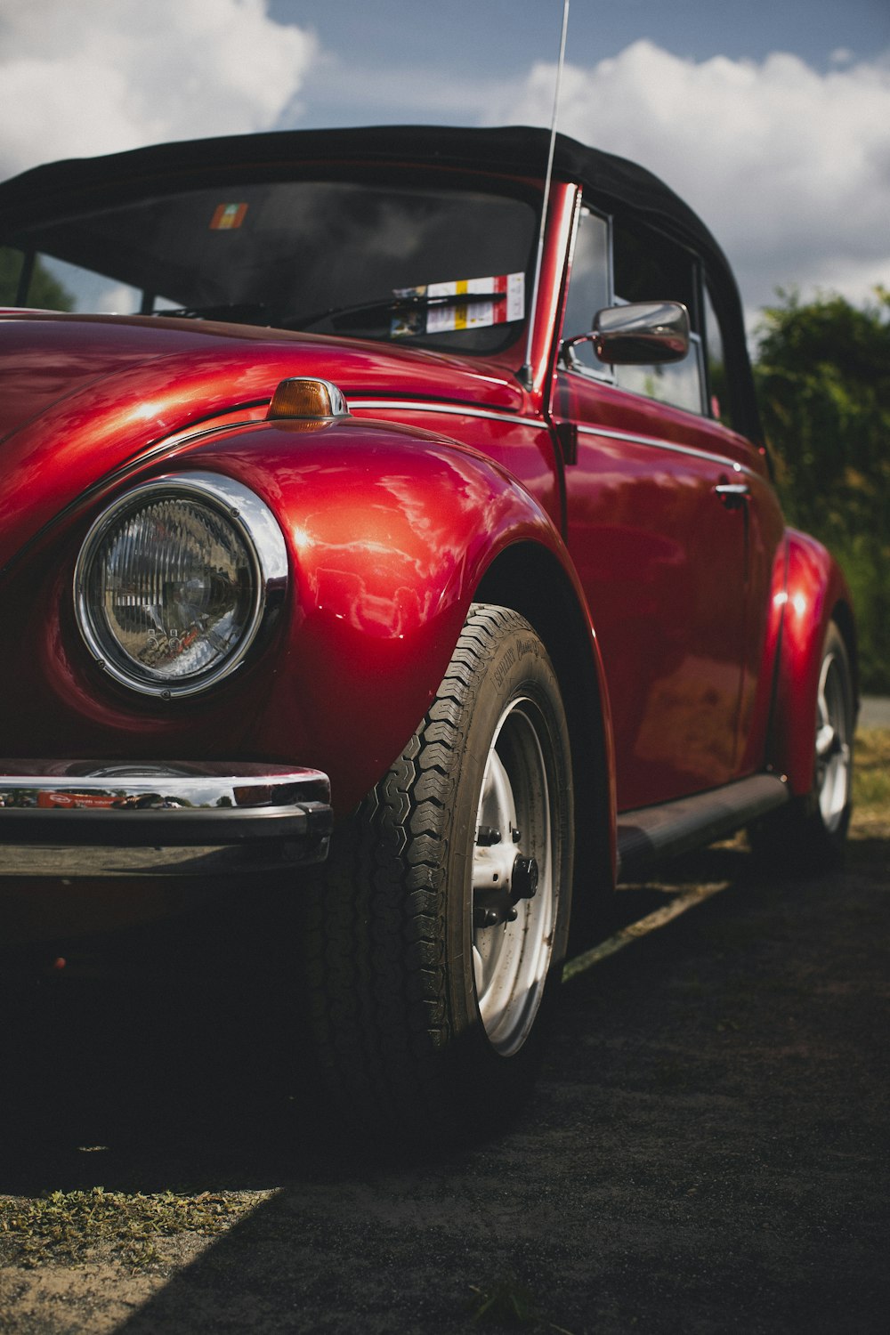 a red car parked on the side of the road