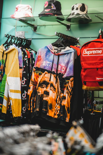 a bunch of shirts hanging up on a rack