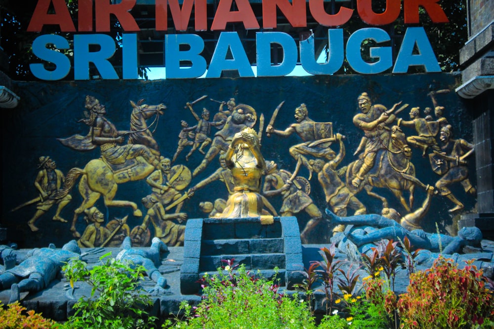 a statue of a man riding a horse in front of a sign