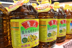 a row of bottles of honey sit on a shelf