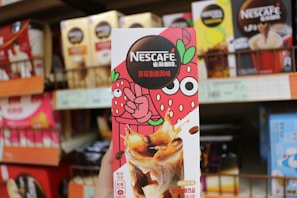 a person holding up a box of ice cream