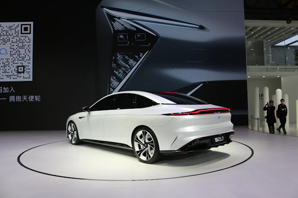 Happy customer finalizing a used car purchase with a seamless online platform background.