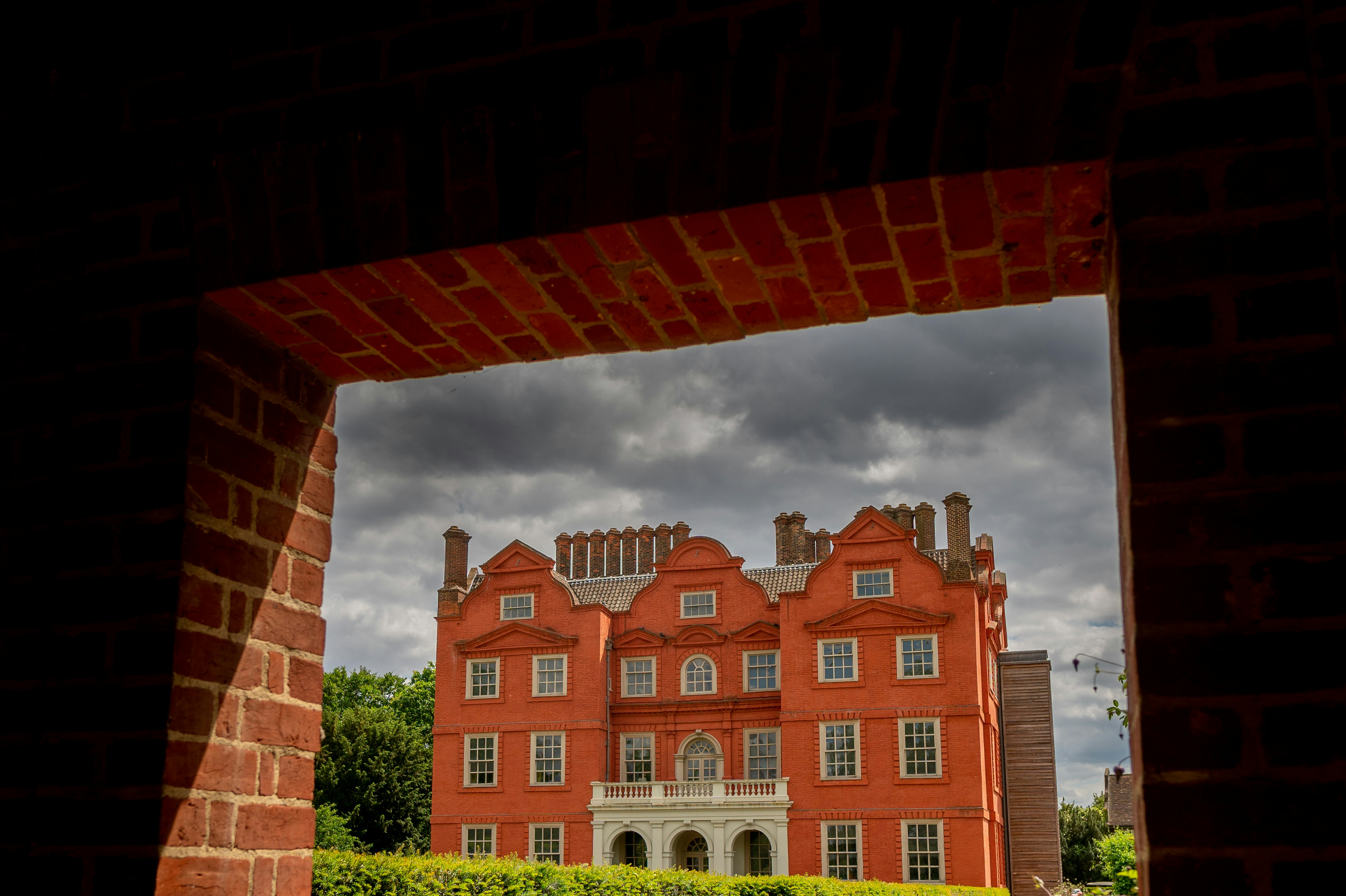 a large red brick building with a clock tower