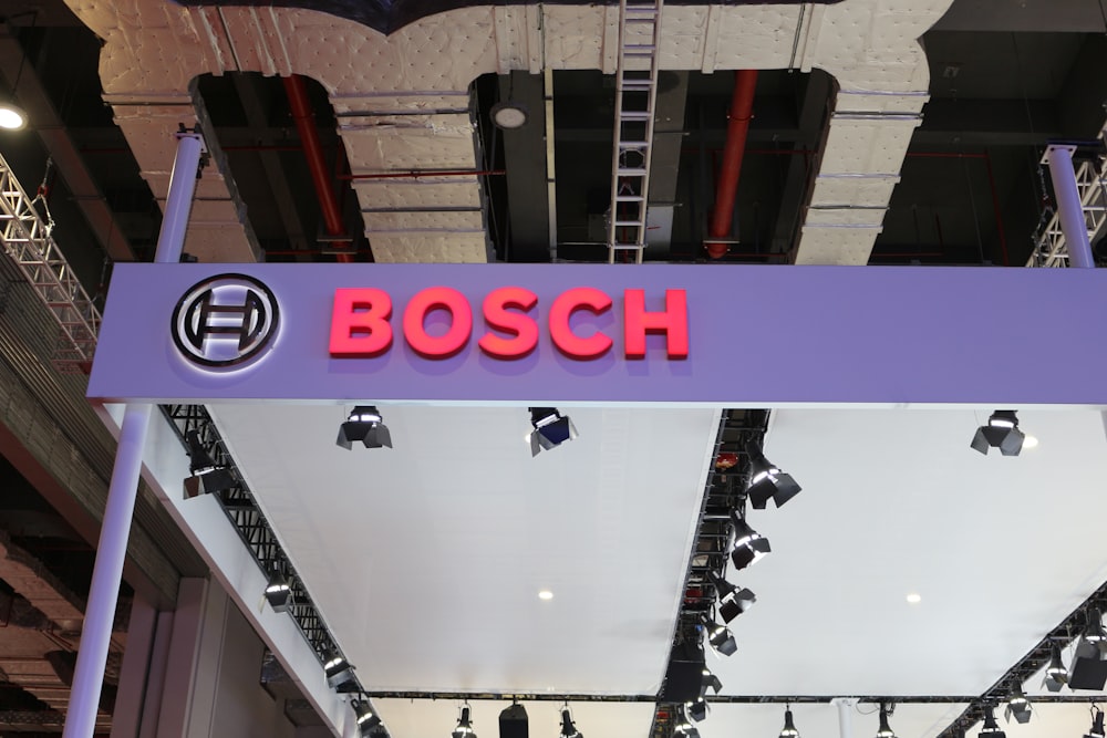 a purple sign that says bosch hanging from the ceiling