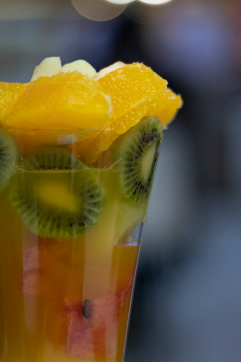 a close up of a fruit drink in a glass