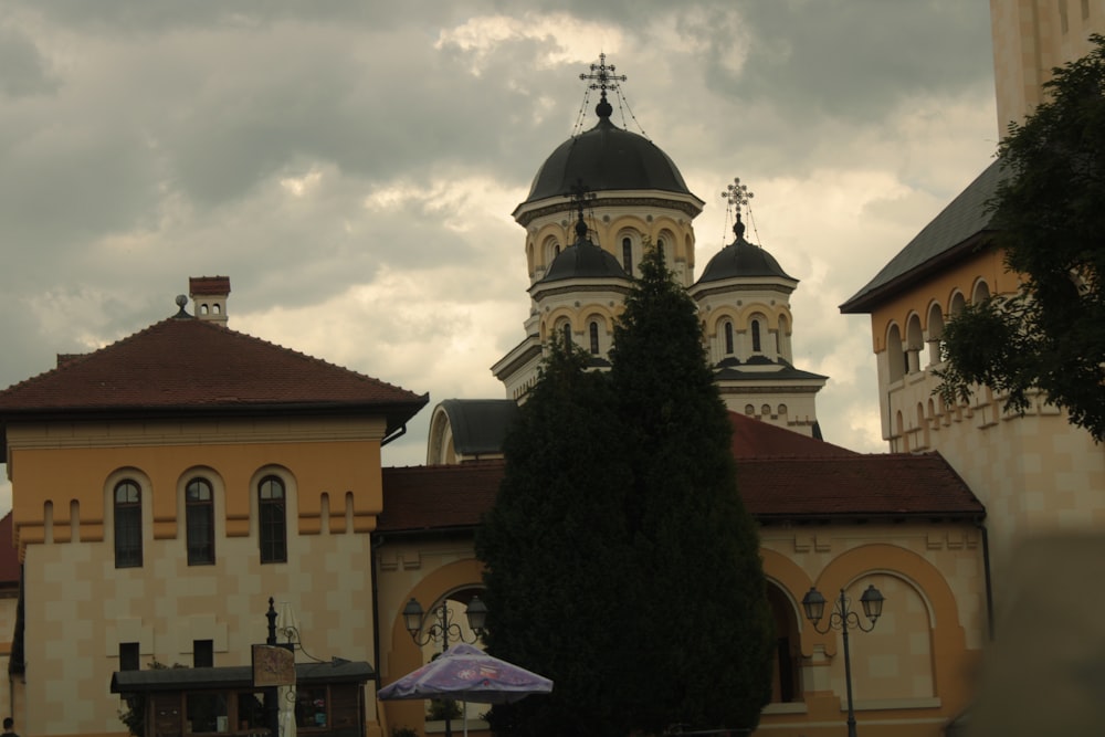 a large building with two towers and a cross on top