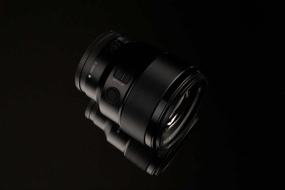 a close up of a camera lens on a black background