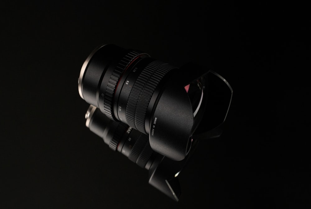 a close up of a camera lens on a tripod