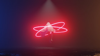 a person standing in the middle of a dark room with a neon light