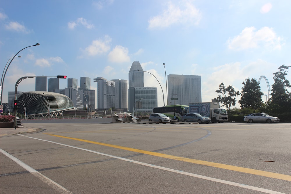 a city street with a lot of cars parked on the side of the road