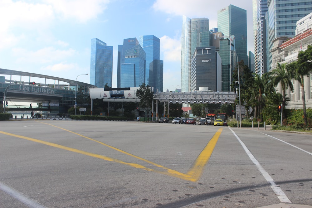 an empty parking lot in a city with tall buildings
