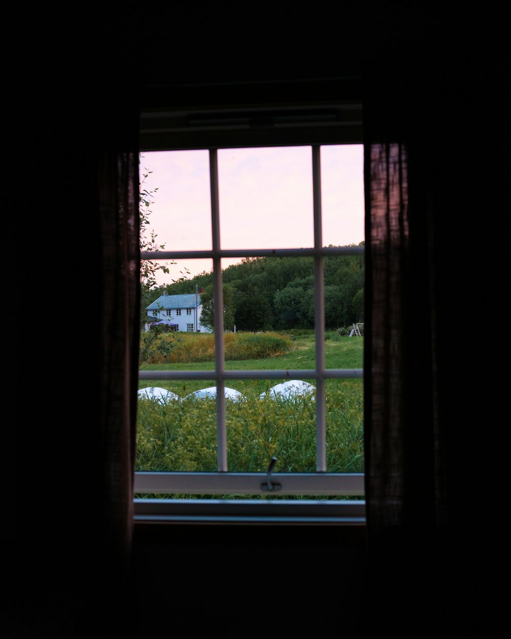 a view of a field through a window