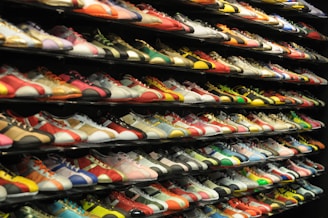 a rack of tennis shoes in a store